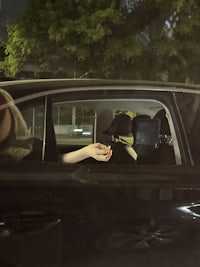 a black car with a person in the driver's seat